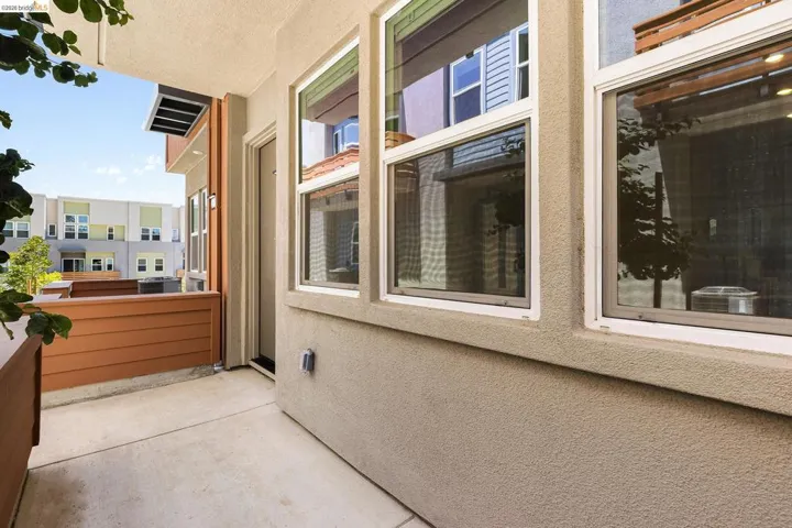 View of home's exterior featuring stucco siding and a balcony