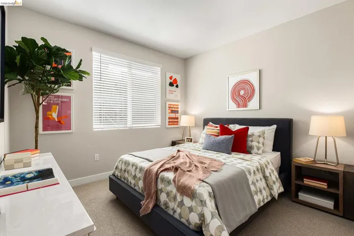 Carpeted bedroom featuring baseboards