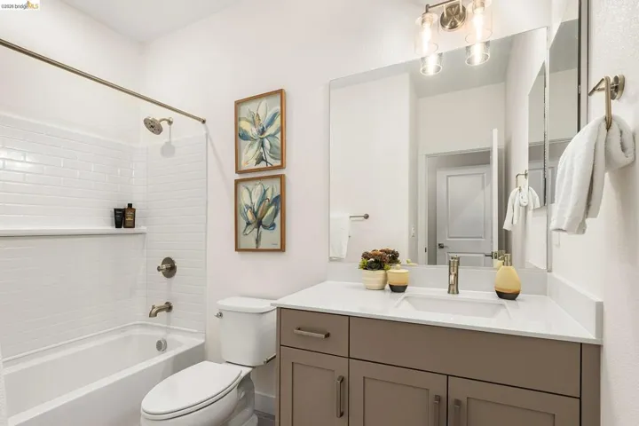 Bathroom featuring vanity and bathtub / shower combination