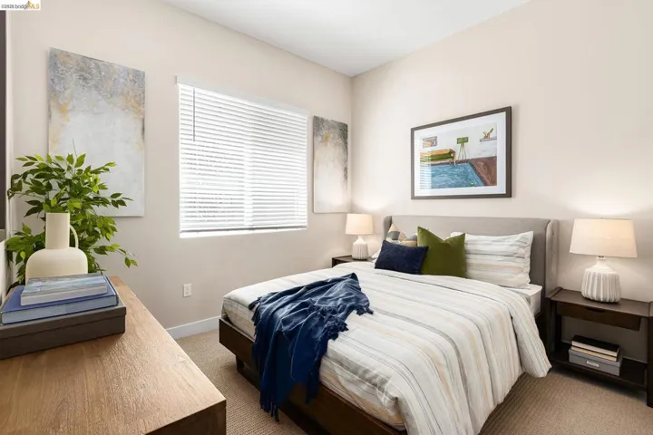 Carpeted bedroom featuring baseboards