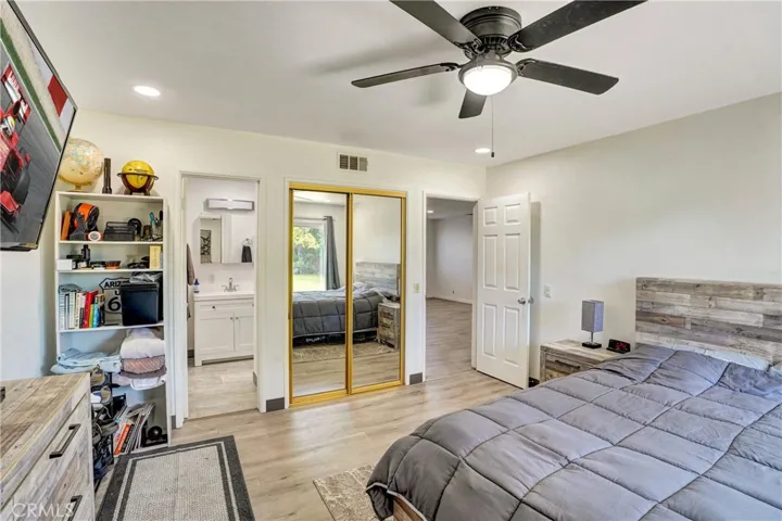 Primary Suite with mirrored wardrobe.