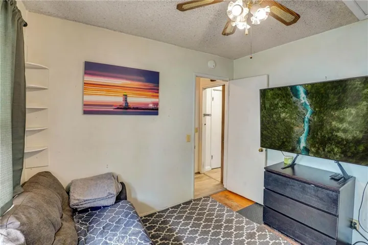 Bedroom with hardwood floors.
