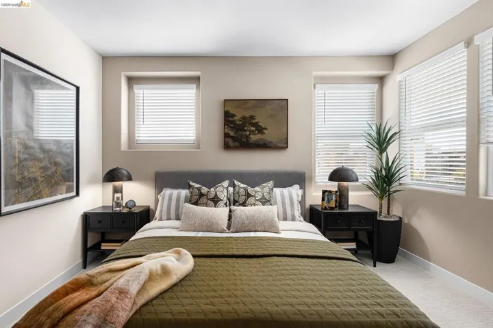 Bedroom featuring multiple windows