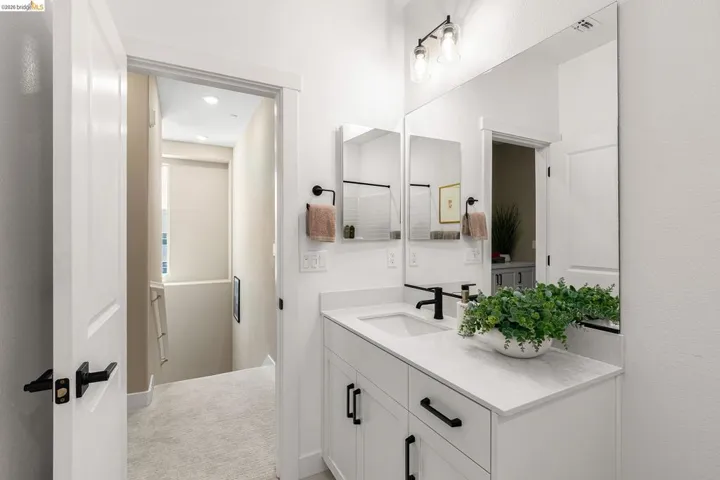 Bathroom featuring vanity and baseboards