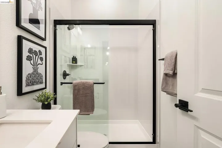Full bath with vanity and a shower stall