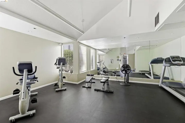 Exercise room with vaulted ceiling