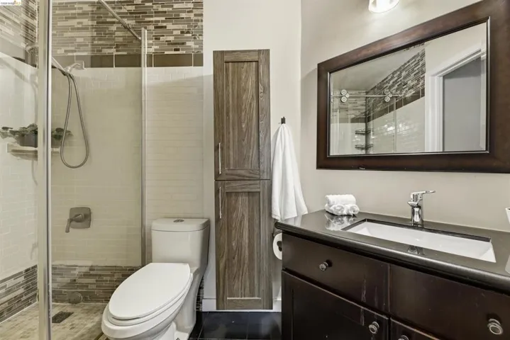Full bath featuring vanity and a stall shower