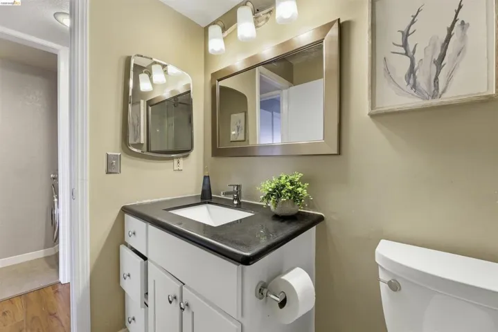 Bathroom with vanity and wood finished floors