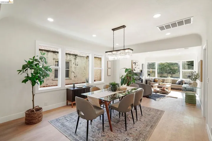 Dining area featuring light wood-style floors and recessed lighting