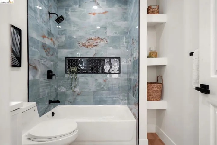 Bathroom featuring  shower combination and toilet