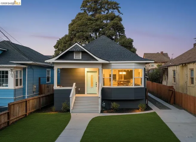 Bungalow-style house featuring covered porch and a shingled roof