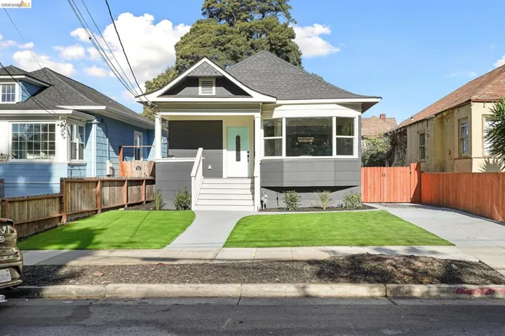 View of front of house with a shingled roof and a porch