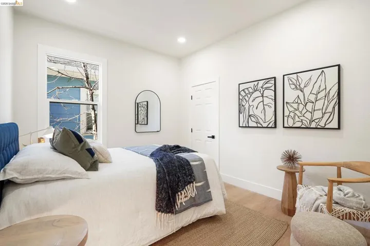 Bedroom with wood finished floors and recessed lighting