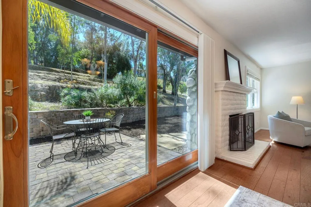 Beautiful wood framed sliders leading off the dining room onto one of several patios
