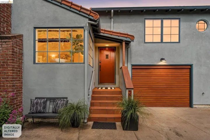 View of exterior entry with stucco siding and an attached garage