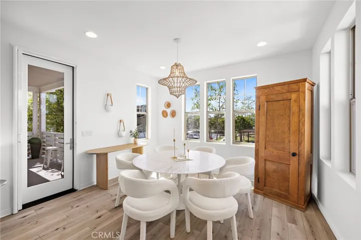 Dining area framed by natural light and warm design elements.