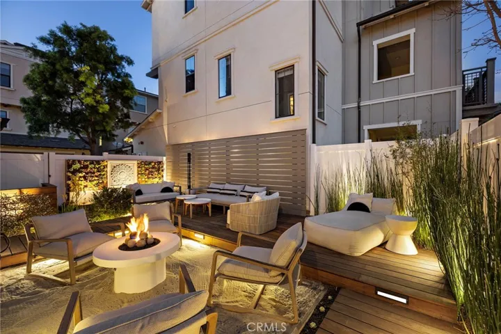 Evening patio lighting creating a warm, resort-inspired setting.