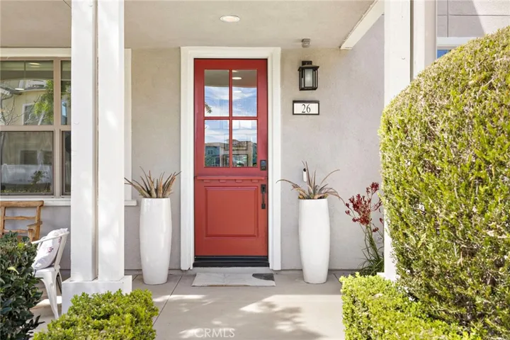 Bright front entry featuring a bold designer dutch door and clean modern lines.