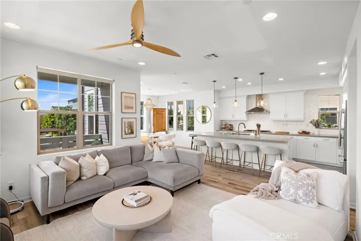 Great room seamlessly connecting living, dining, and kitchen spaces.