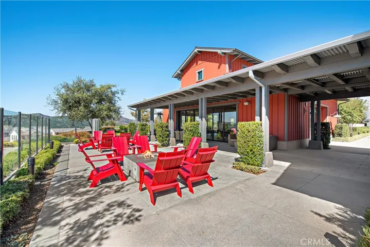 Resident gathering area with firepit seating and inviting community setting.