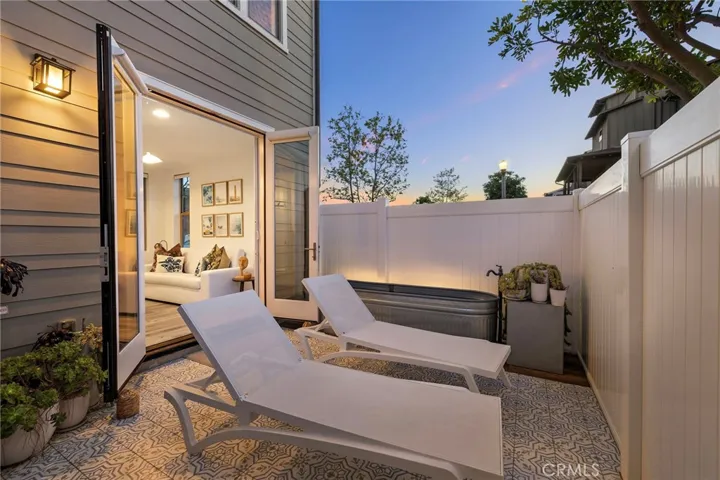 Evening patio lighting creating a warm, resort-inspired setting.