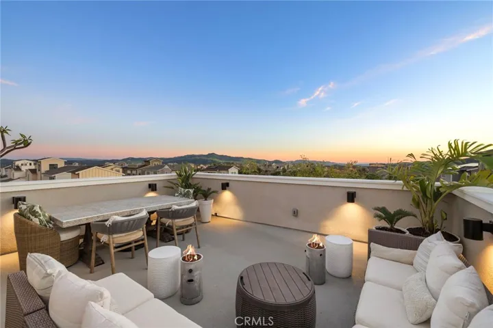 Private rooftop retreat with sunset views and sweeping neighborhood vistas.
