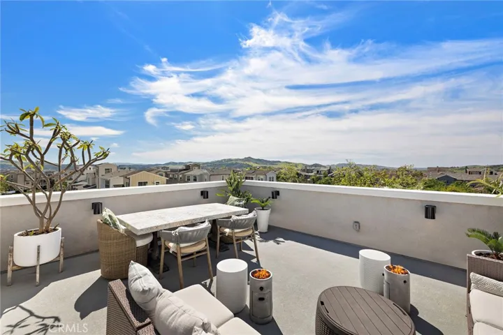 Rooftop living space opening to expansive views.