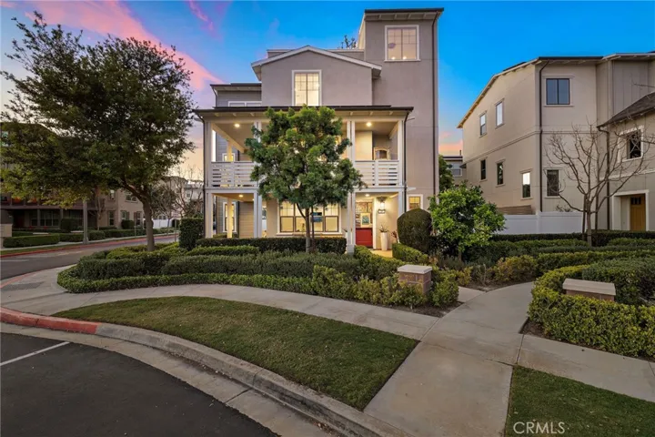 Evening exterior illuminated by warm lighting and an inviting front elevation.