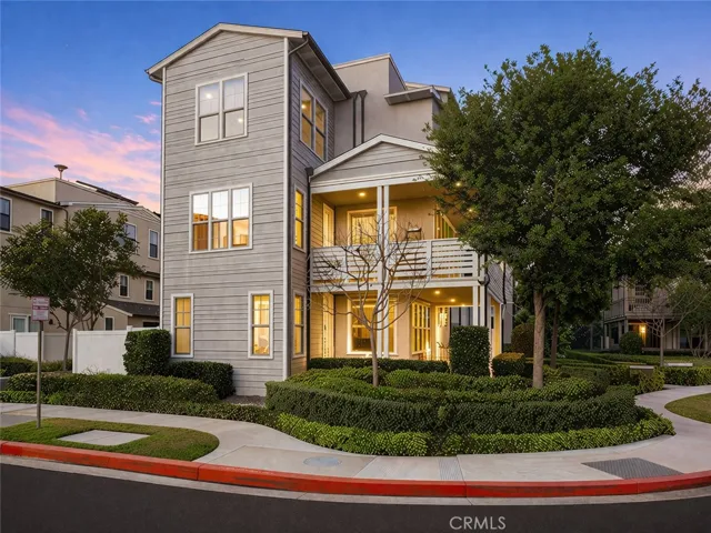 Twilight exterior with curated landscaping and standout curb appeal.