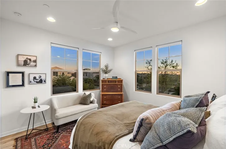 Evening primary bedroom ambiance with warmth and tranquility.