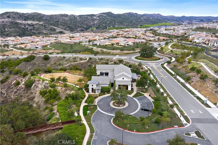 Community center aerial highlighting neighborhood amenities and natural surroundings.
