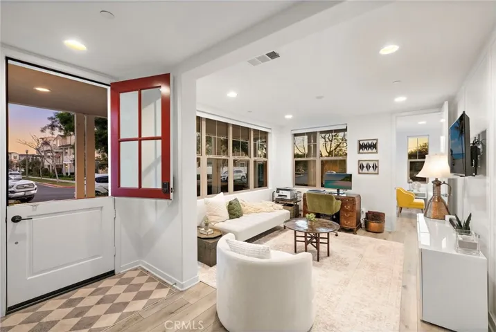 Open entry flowing into light-filled interiors with an airy modern feel.