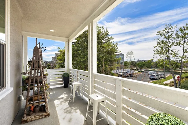 Covered balcony offering a private perch for morning coffee or sunset views.
