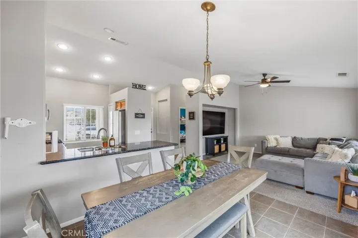 View from dining room of kitchen, front entry, and family room