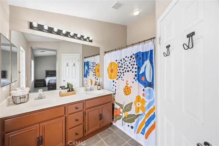 Primary bathroom with dual vanity sinks