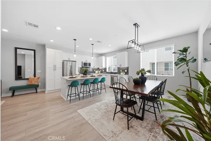 Main Level Great Room - Fully upgraded kitchen with stainless steel appliances, large dining area