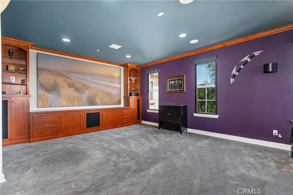 Media room/Loft with theater seating and blackout blinds