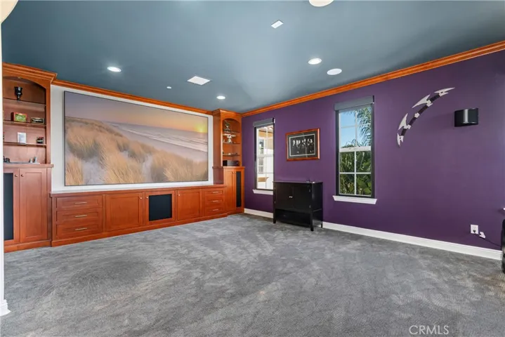 Media room/Loft with theater seating and blackout blinds