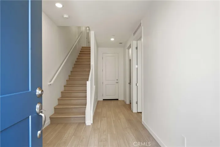 Entry from Courtyard LVP Flooring throughout