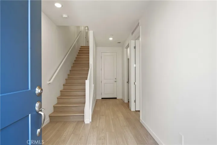Entry from Courtyard LVP Flooring throughout
