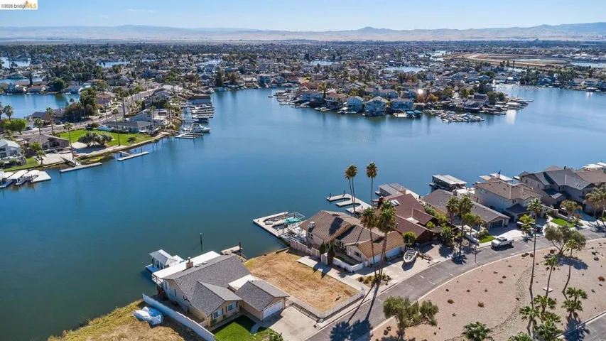 Aerial perspective of suburban area featuring a water and mountain view