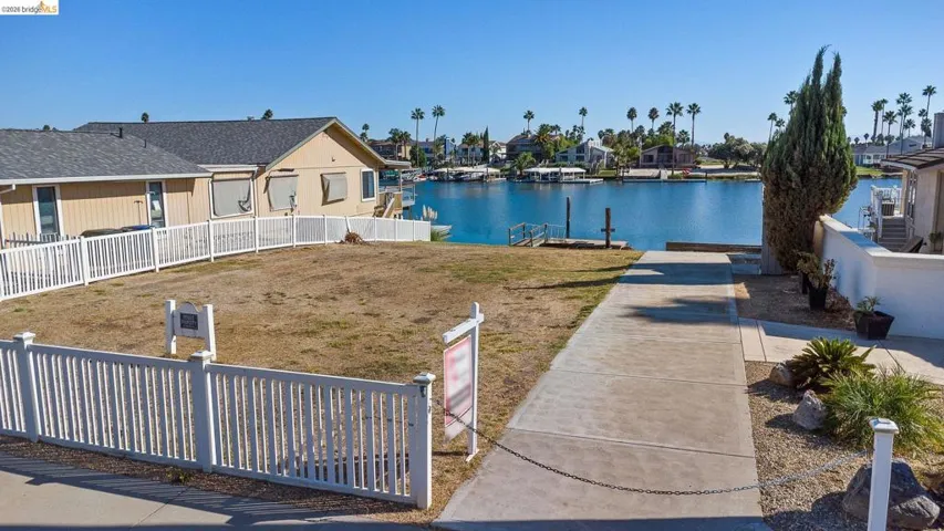 Dock with a water view and a residential view