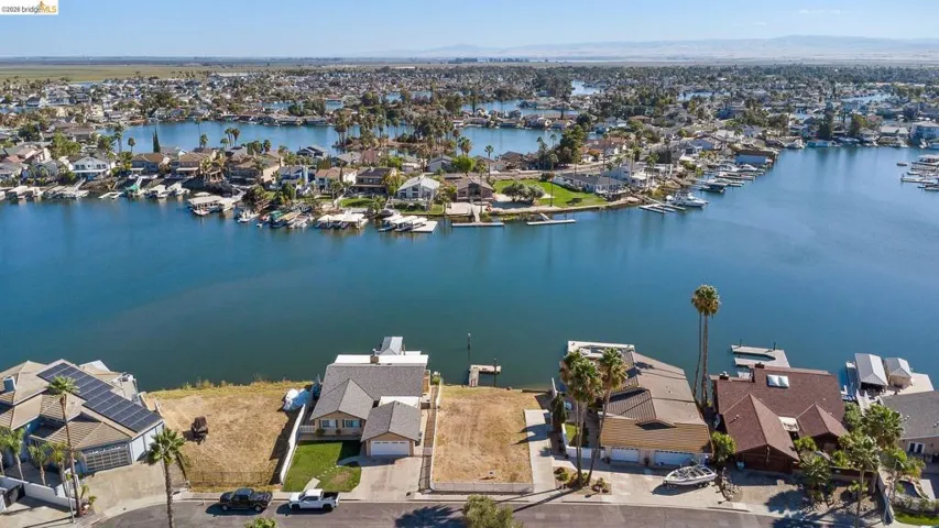 Aerial view of residential area featuring a water and mountain view