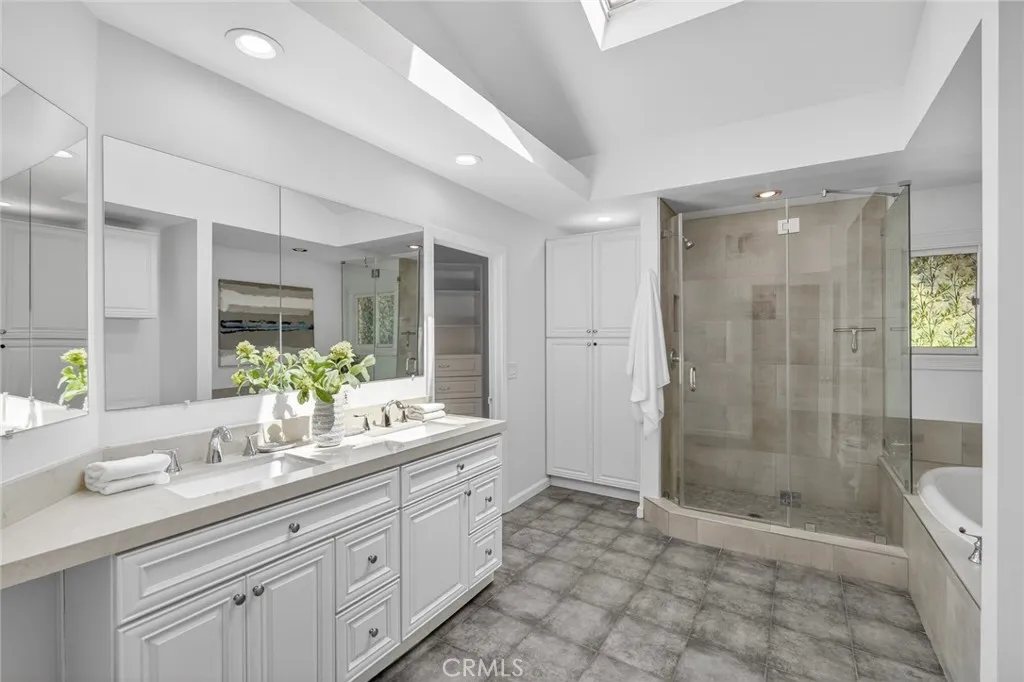 Bathroom in Primary Suite with standing shower and soaking tub