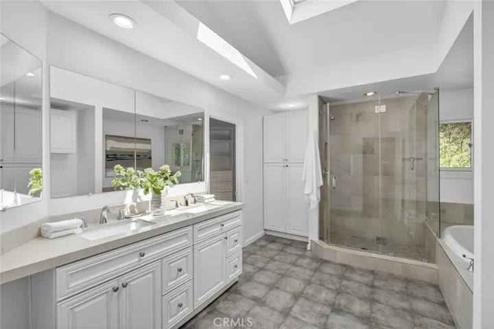 Bathroom in Primary Suite with standing shower and soaking tub
