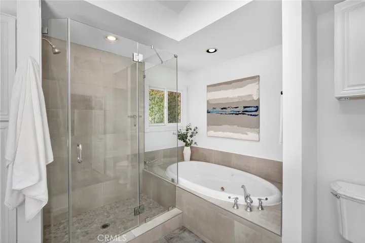 Bathroom in Primary Suite with standing shower and soaking tub