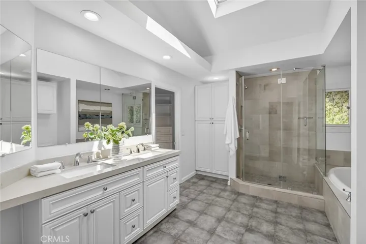Bathroom in Primary Suite with standing shower and soaking tub