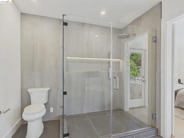 Full bath with ensuite bath, a shower stall, and recessed lighting