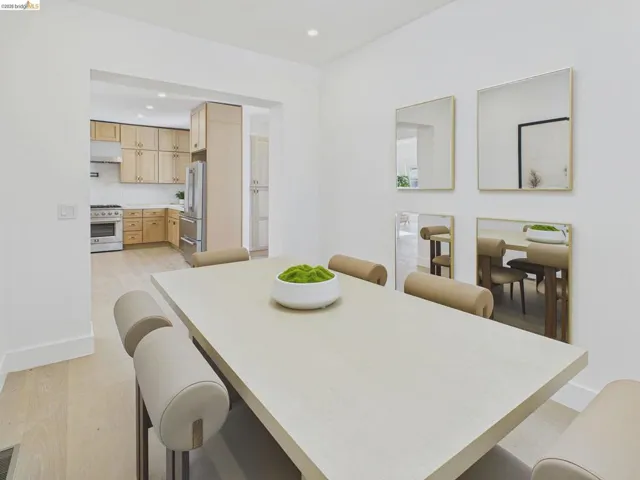 Dining area featuring light wood-style floors and recessed lighting
