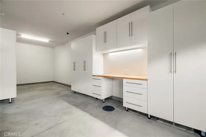 3-car tandem garage with custom built-in workbench and storage